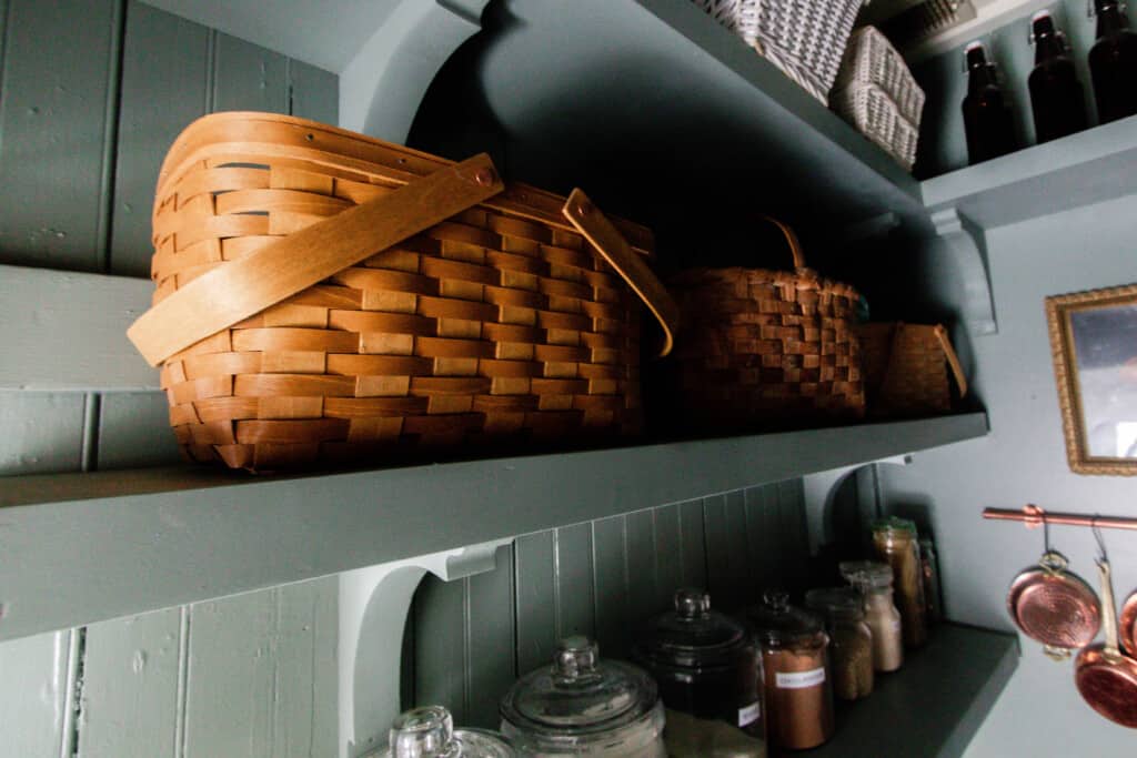 baskets on wooden shelves held up but wooden corbels