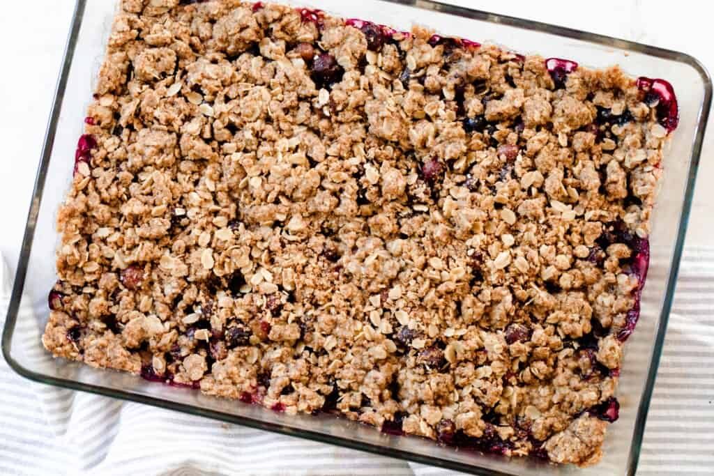 einkorn berry crisp with a einkorn oat topping in a glass baking dish