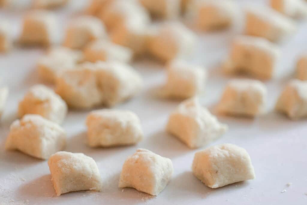 homemade gnocchi dough sliced into 1 inch squares