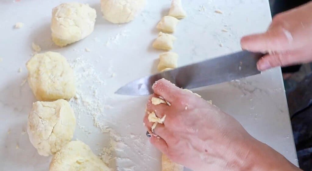 slicing homemade gnocchi