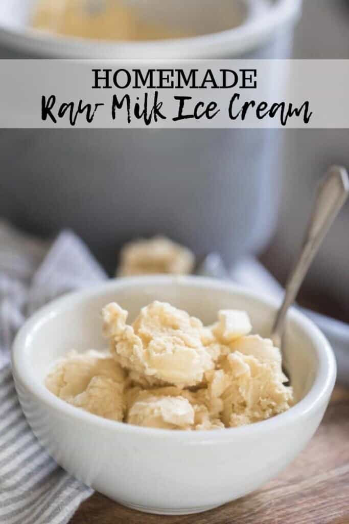 raw milk ice cream in a white bowl with a spoon on a wooden table with the ice cream canister in the background