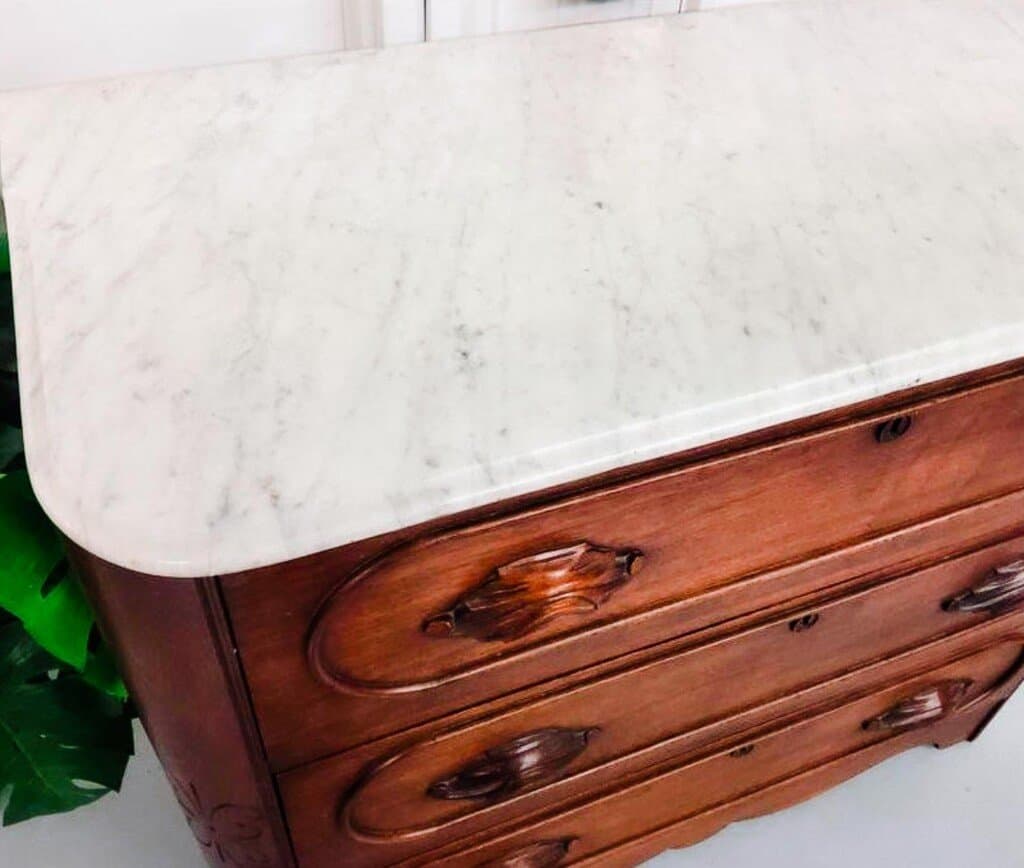 top view of a vintage marble top bed dresser