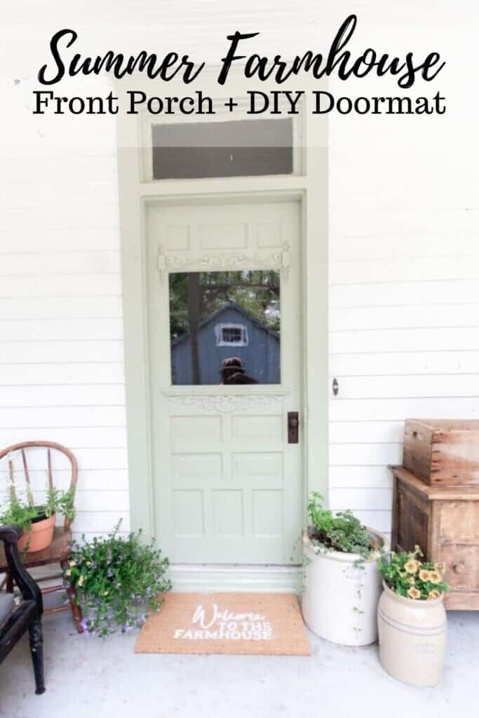 sage green farmhouse front door with a DIY Cricut doormat. Crocks with flowers sit to the right and a antique wooden chair with flowers in a pot on the right of the door