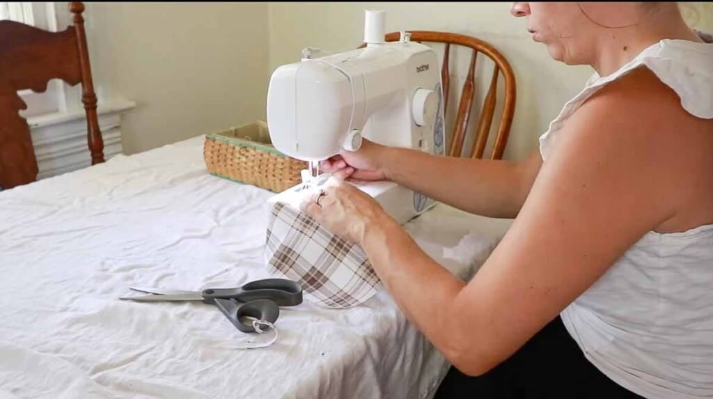 women sitting at a sewing machine sewing a pocket