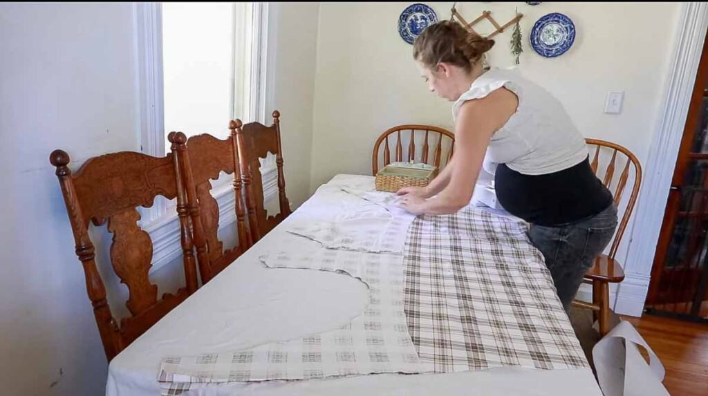 women placing two pieces of fabric together to make an apron