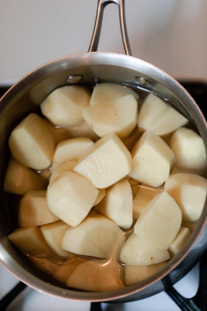 peel and chopped potatoes in a pot with water