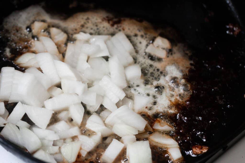 onions cartelizing in butter in a cast iron skillet