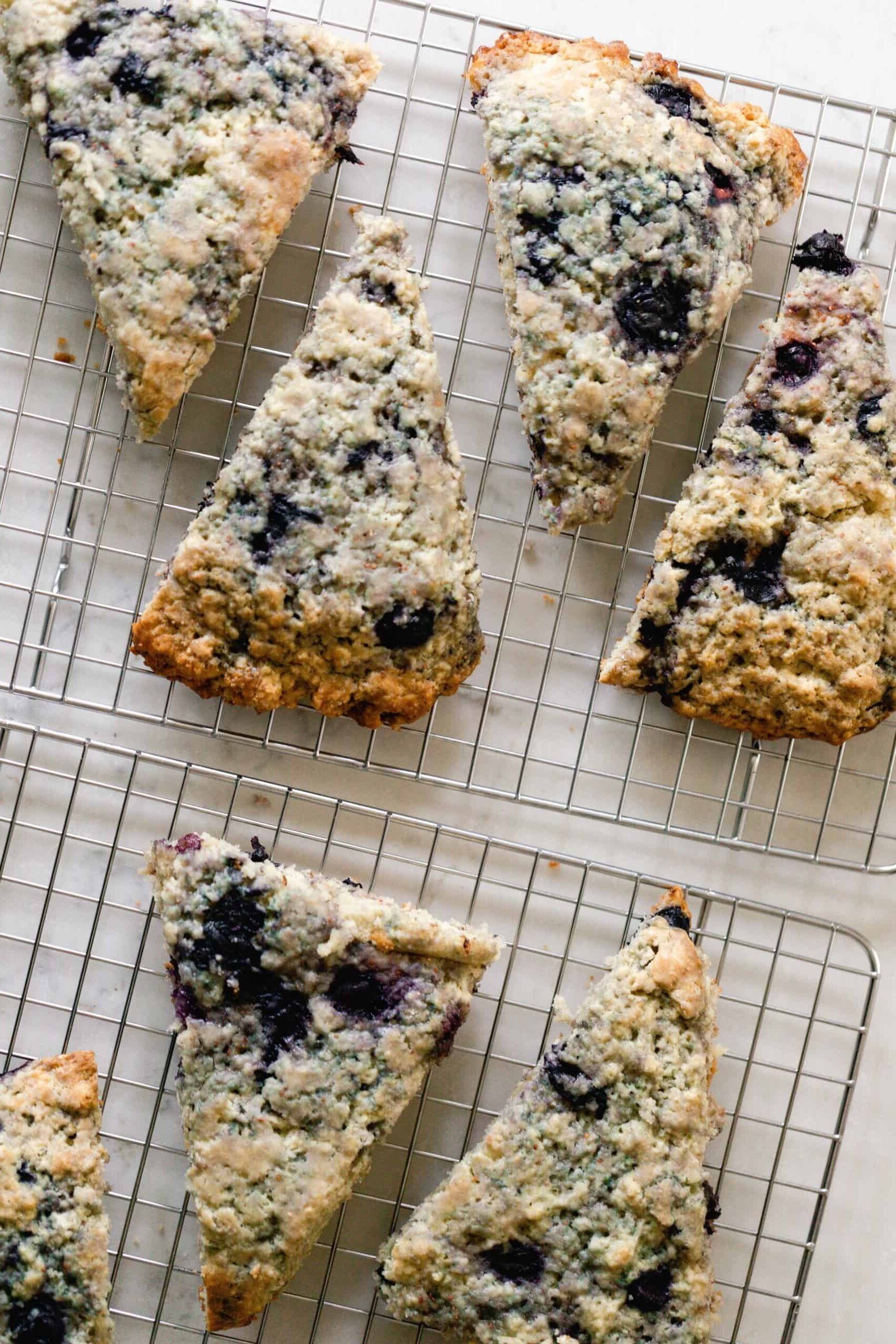 overhead image of blueberry sourdough scones on a wire rack right after baking