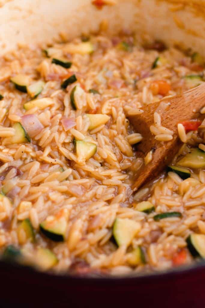 orzo with veggies cooking in a large pot