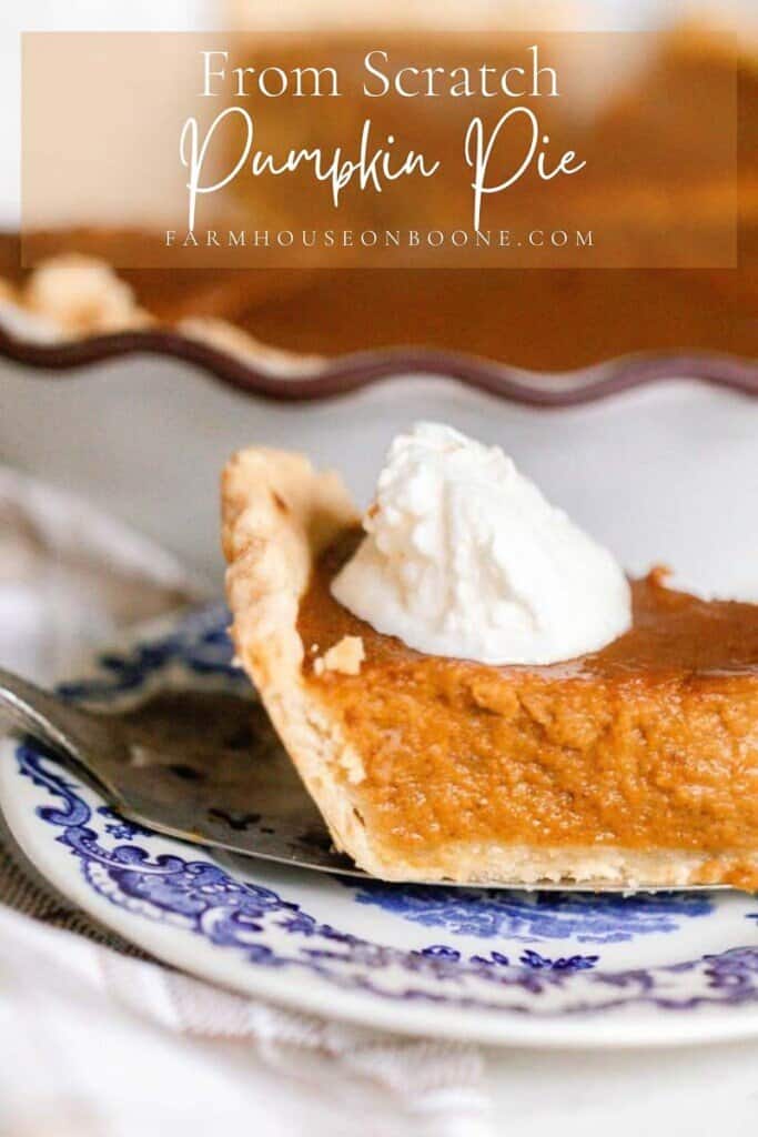 slice of pumpkin pie made from scratch with a dollop of whipped cream on a antique blue and white plate. The rest of the pie is in the background