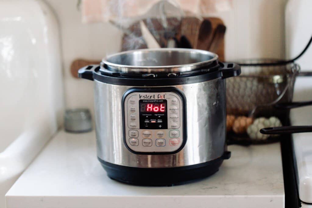 instant pot on the sauté function on a white countertop