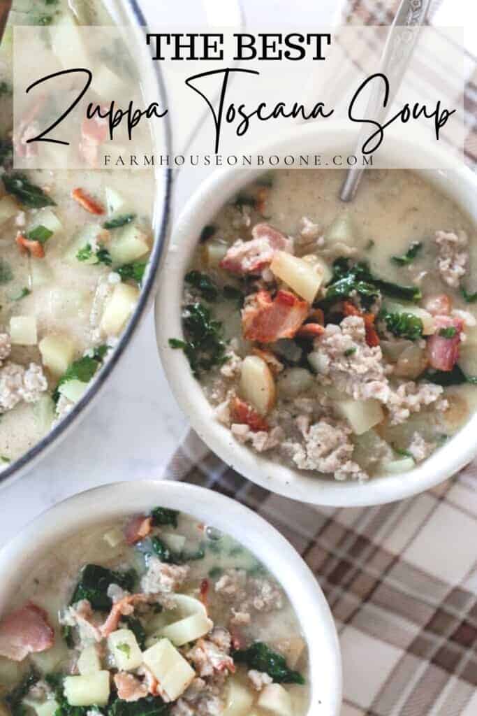 two bowls of zuppa toscana soup with potatoes, sausage, bacon, kale in white bowls with a pot of soup to the left.