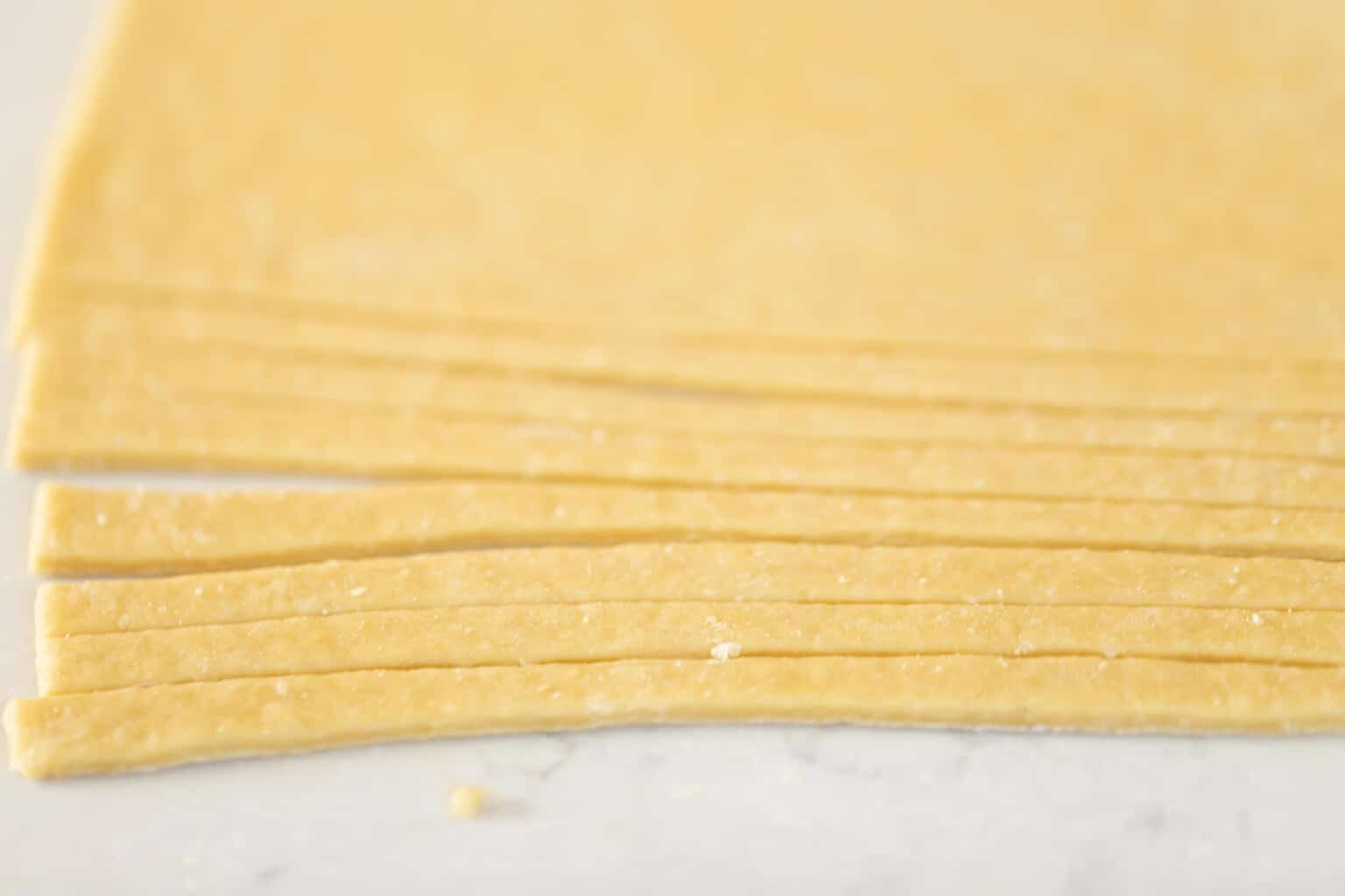 homemade noodle soup sliced into long strips