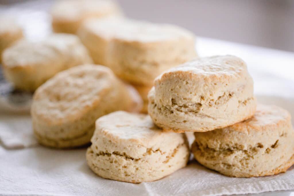 biscuits layered on top of each other on a white quartz countertop 