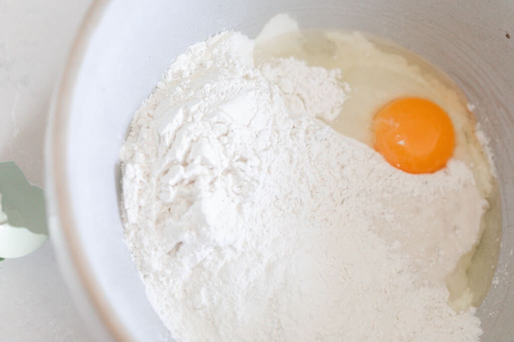 flour and egg in a white ironstone bowl.