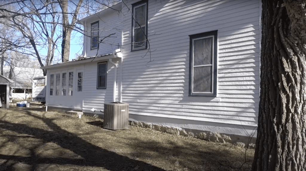 before picture of the back of a 1800's victorian farmhouse