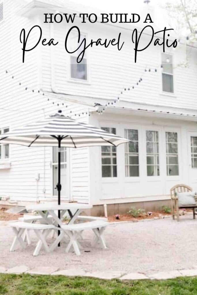 pea gravel patio with a flagstone boarder in the back of a white farmhouse