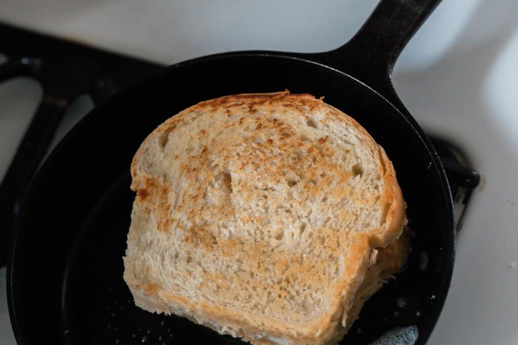 sourdough grilled cheese cookie gin a cast iron skillet.