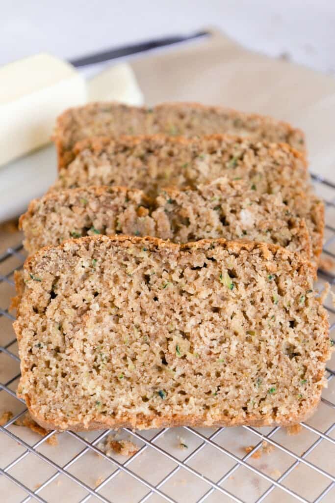 close up picture of sourdough zucchini bread on a wire rack