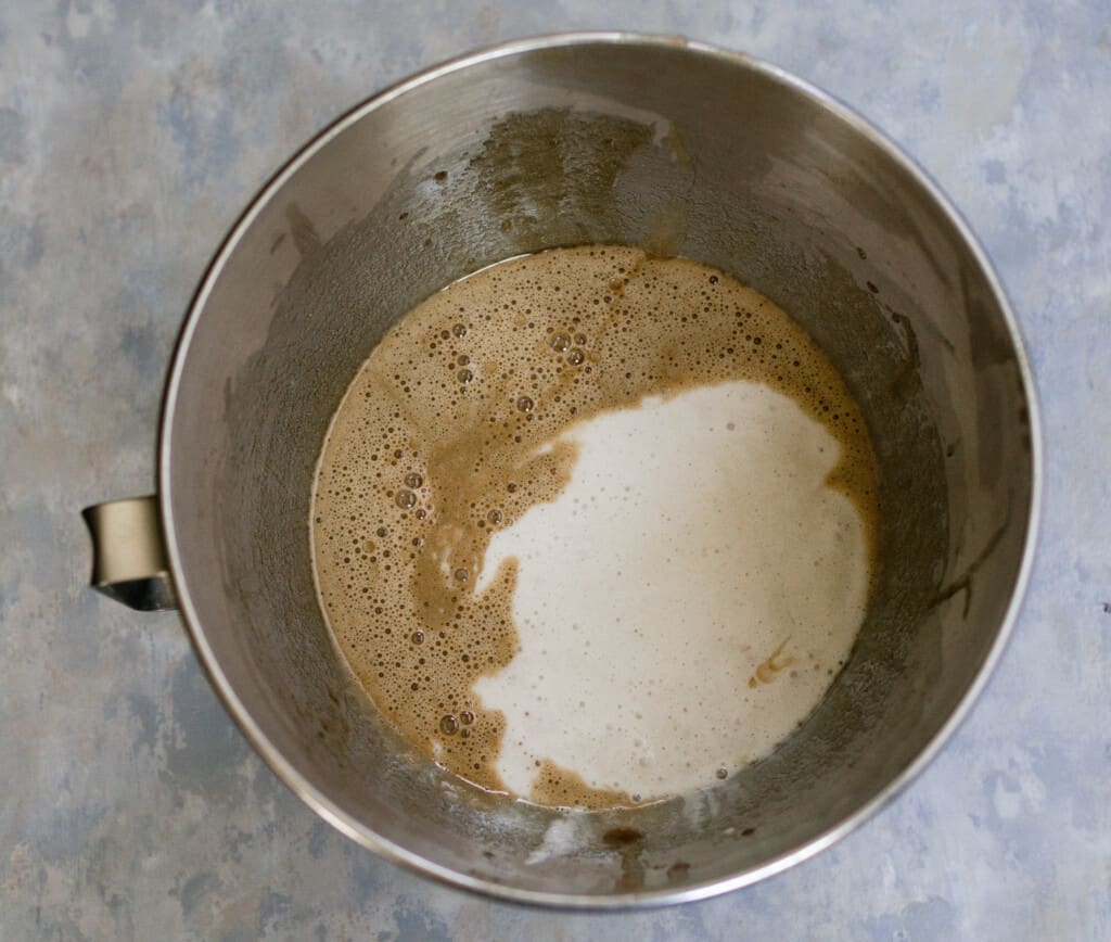sourdough starter, olive oil, brown sugar, vanilla and almond extract in a metal mixing bowl
