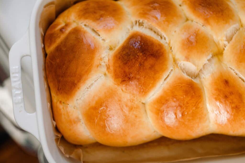 overhead photo of a braided loaf of sourdough challah