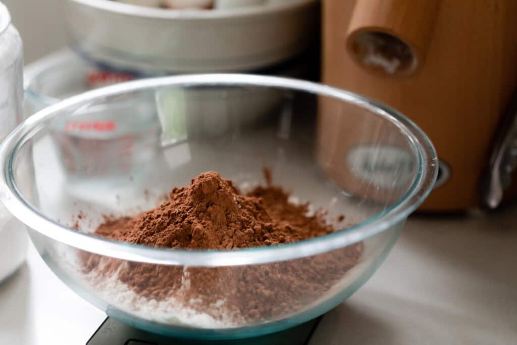 glass bowl with cocoa powder and flour.