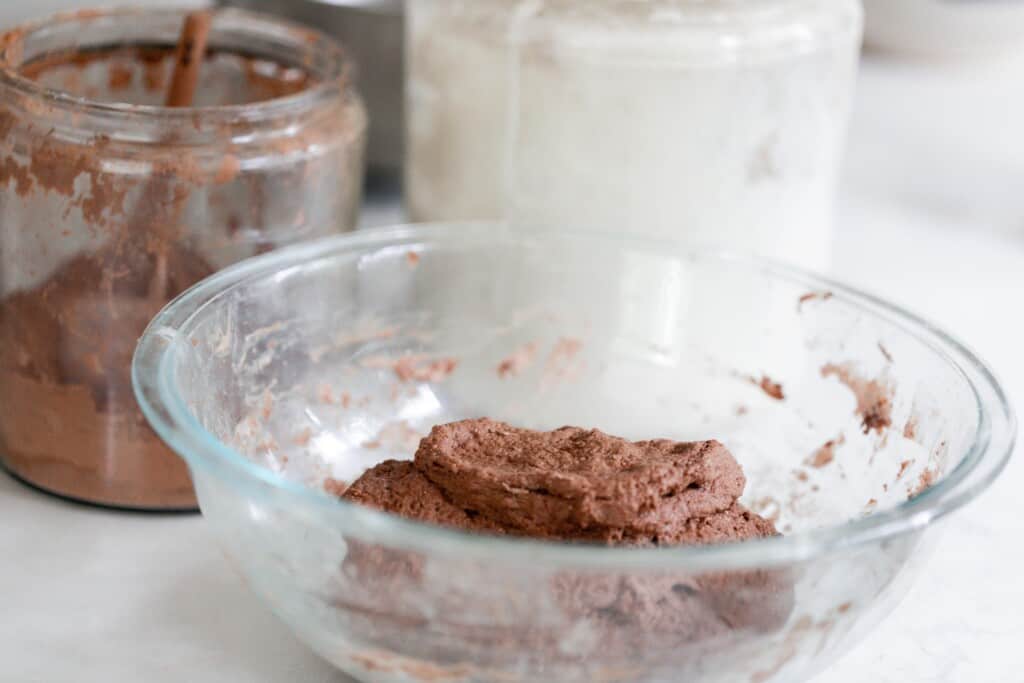 glass bowl with sourdough chocolate bread ingredients mixed