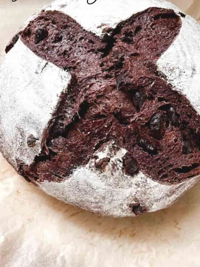 loaf of crust chocolate sourdough bread on parchment paper