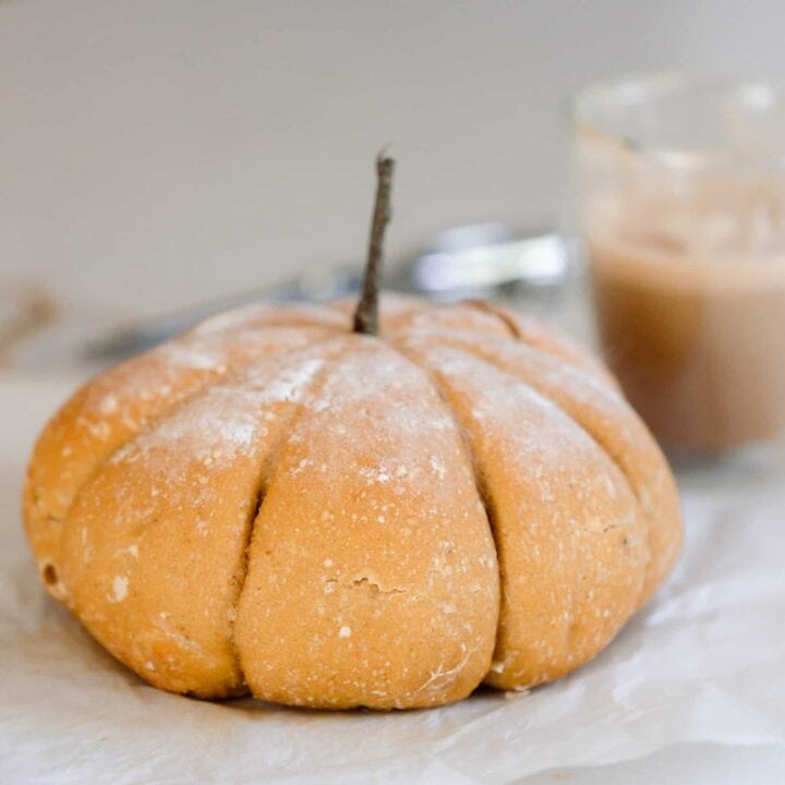 a loaf of sourdough bread in the shape of a pumpkin