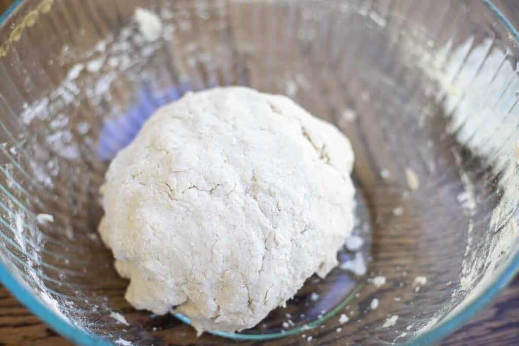 gluten free sourdough bread dough ball in a glass bowl