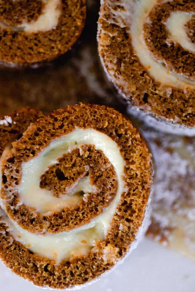 overhead photo of slices of sourdough pumpkin rolls on parchment paper