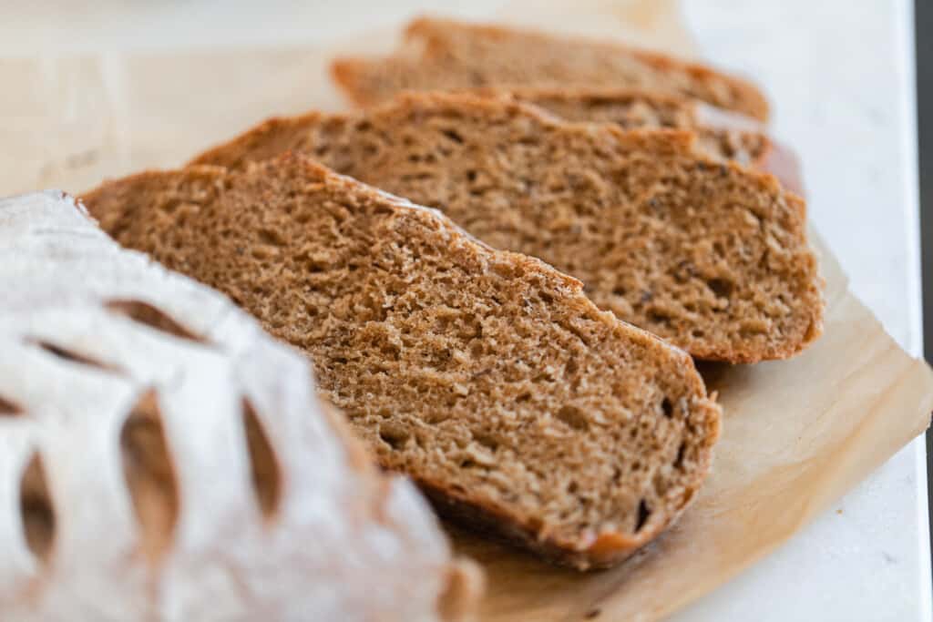 slices of sourdough rye bread on parchment paper