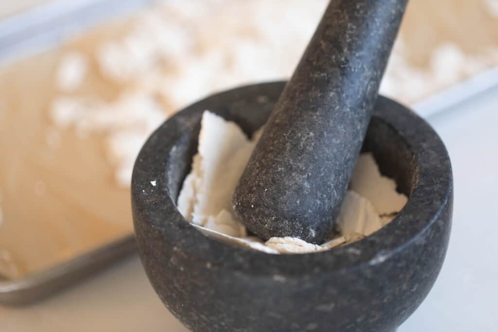 sourdough starter in a black mortar and pestle