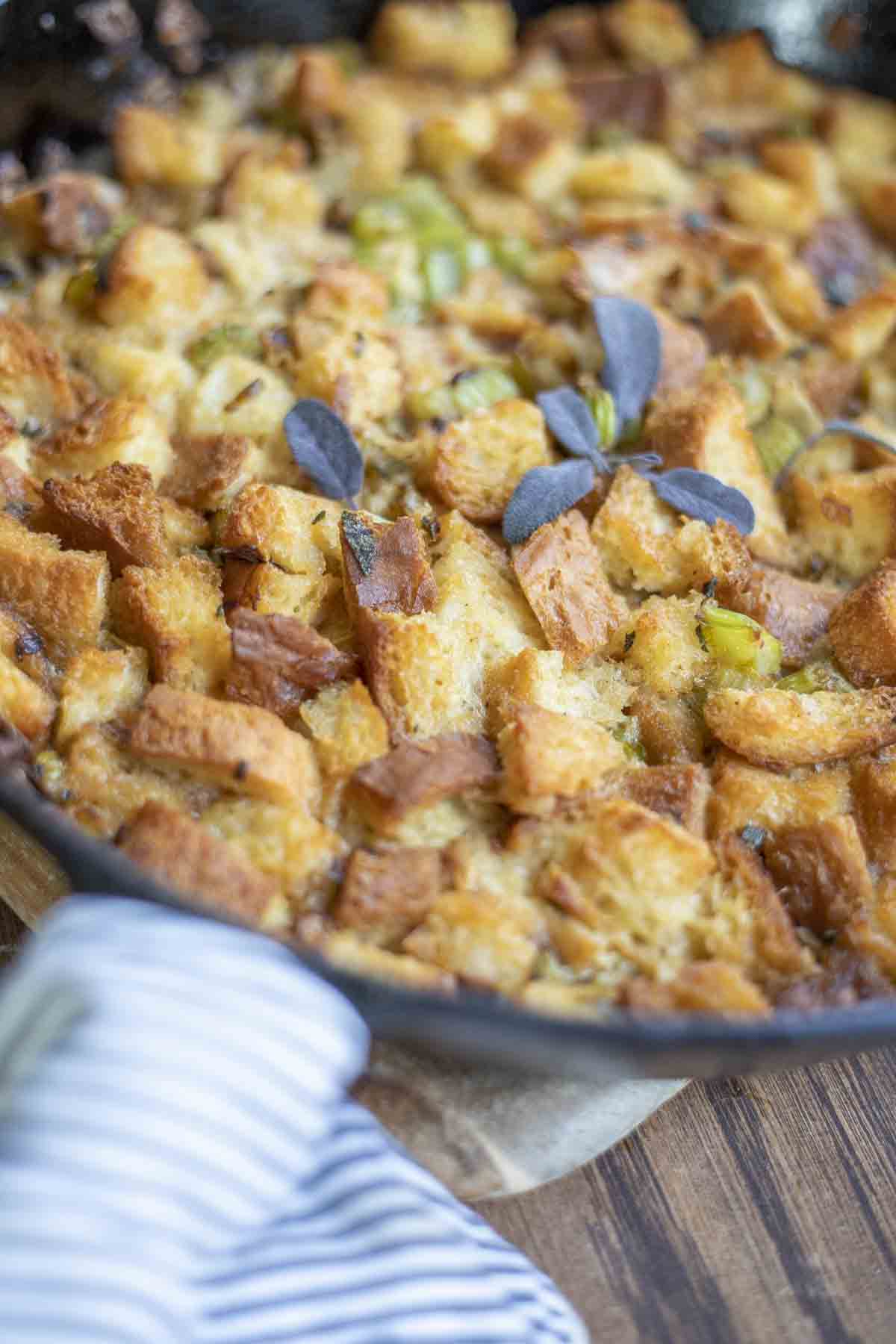 Gluten free sourdough stuffing in a cast iron skillet.