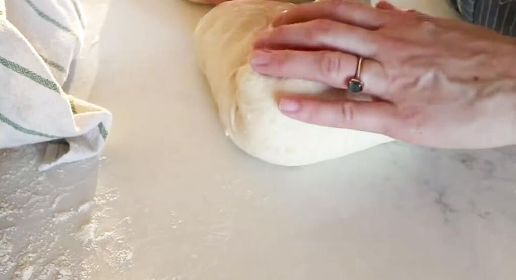 shopping a dough ball on a white quartz countertop