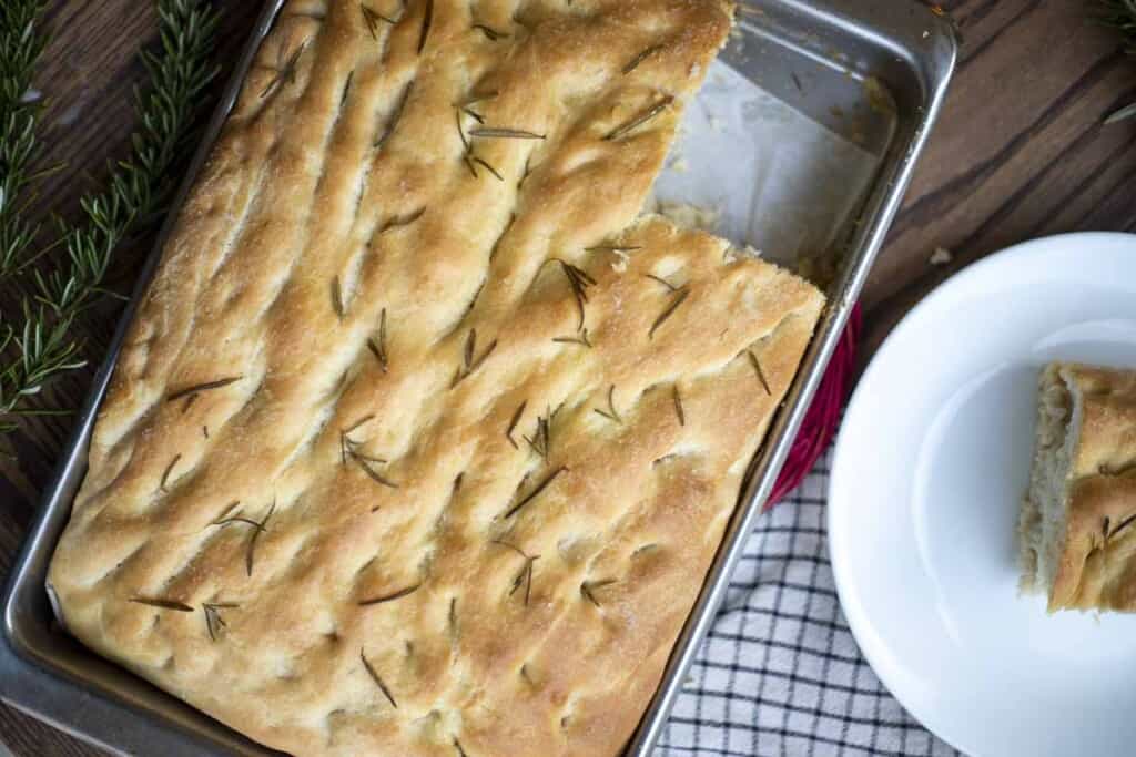 overhead photo of sourdough focaccia in a pan 