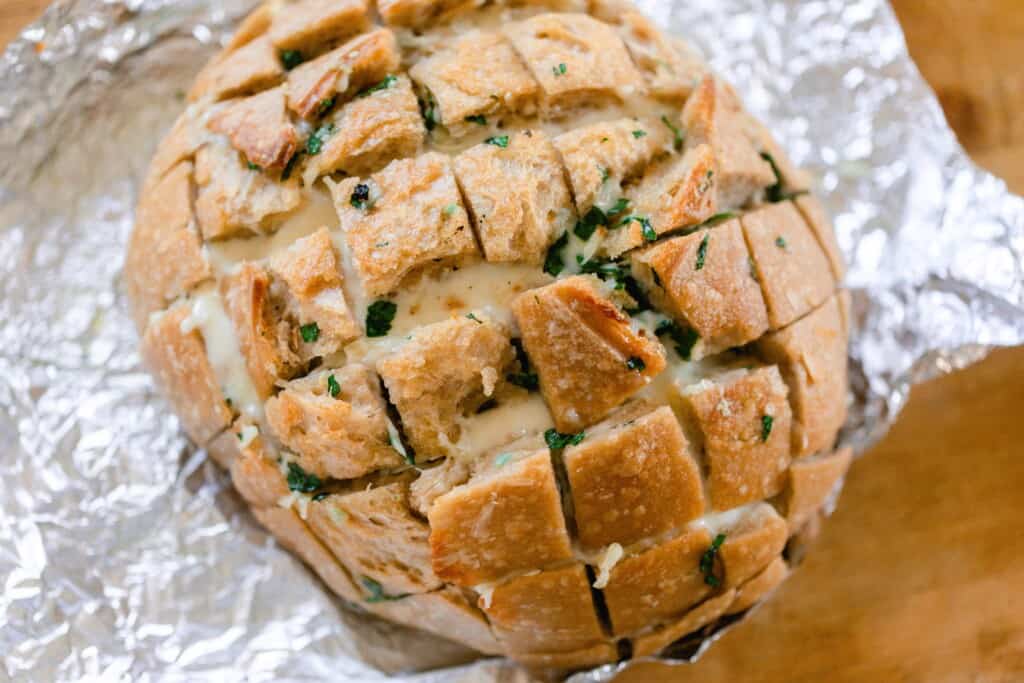 sourdough pull apart bread fresh from the oven on foil