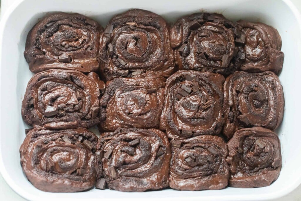 sourdough chocolate sweet rolls in a white baking dish