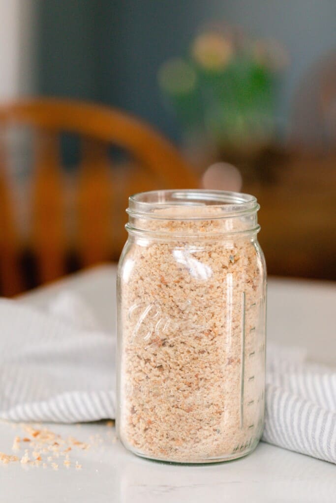 sourdough breadcrumbs in a quart mason jar on a table