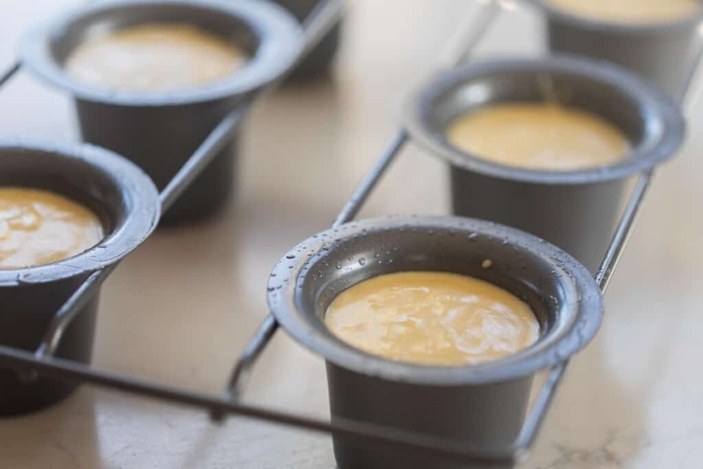 sourdough popover batter in a popover tin ready to be baked