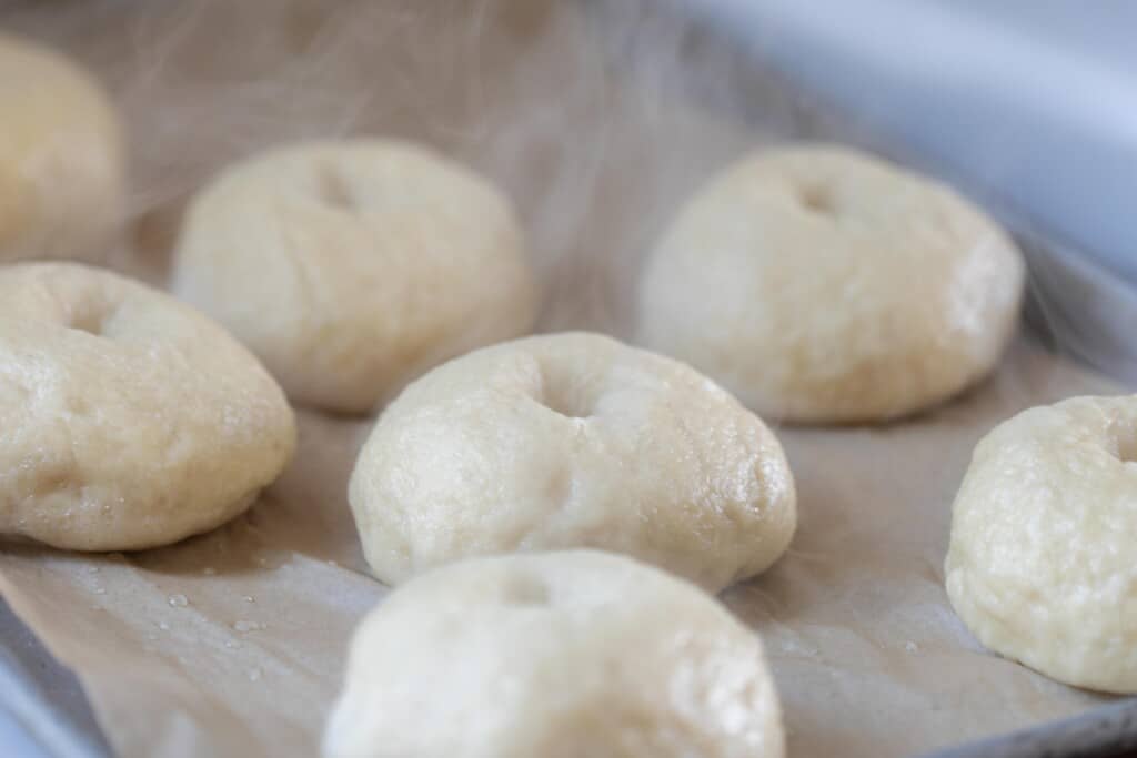 bagels boiled and placed on parchment paper