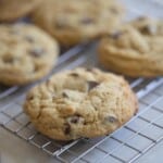 six sourdough chocolate chip cookies on a wire rack