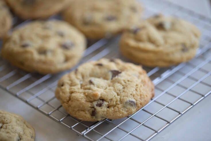 six sourdough chocolate chip cookies on a wire rack