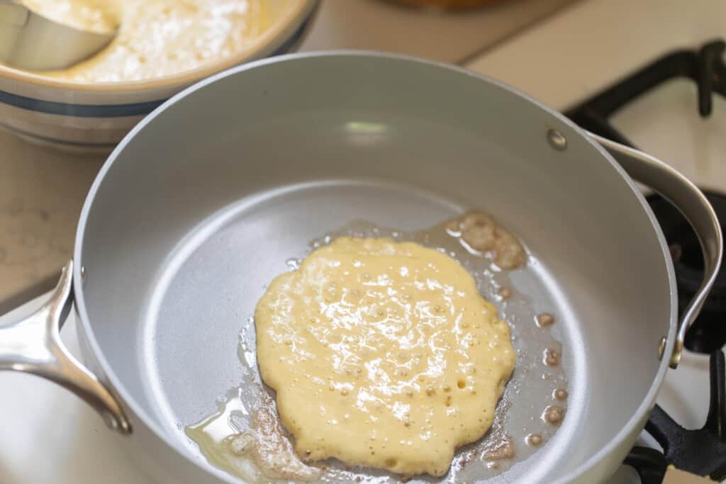 sourdough pancake cooking in a skillet