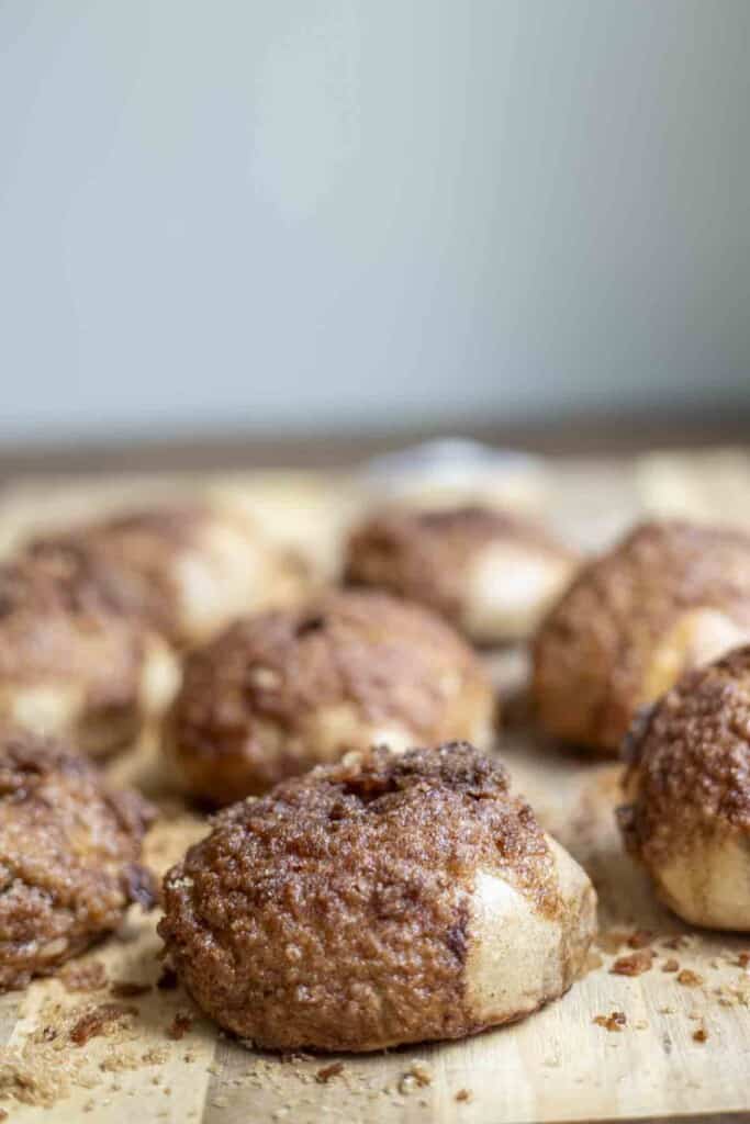 8 sourdough cinnamon crunch bagels on a wood cutting board 