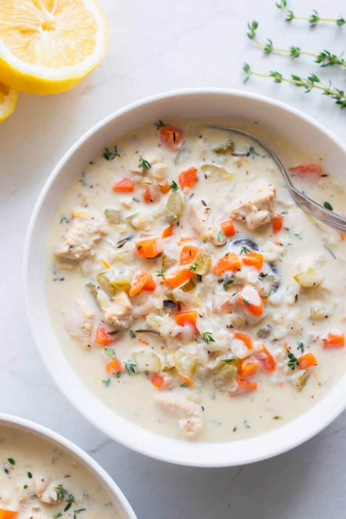 A large bowl full of chicken and wild rice soup.