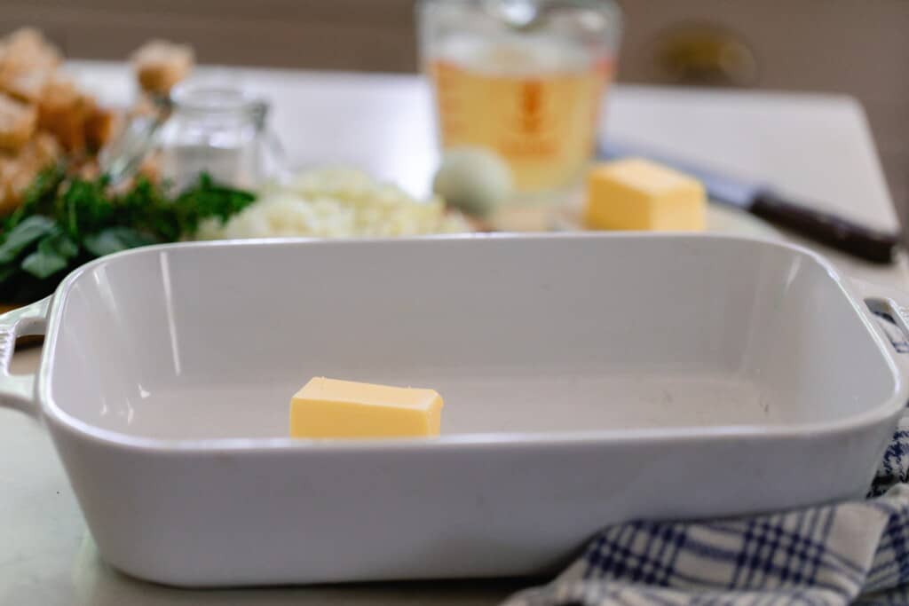 butter in a white baking dish 