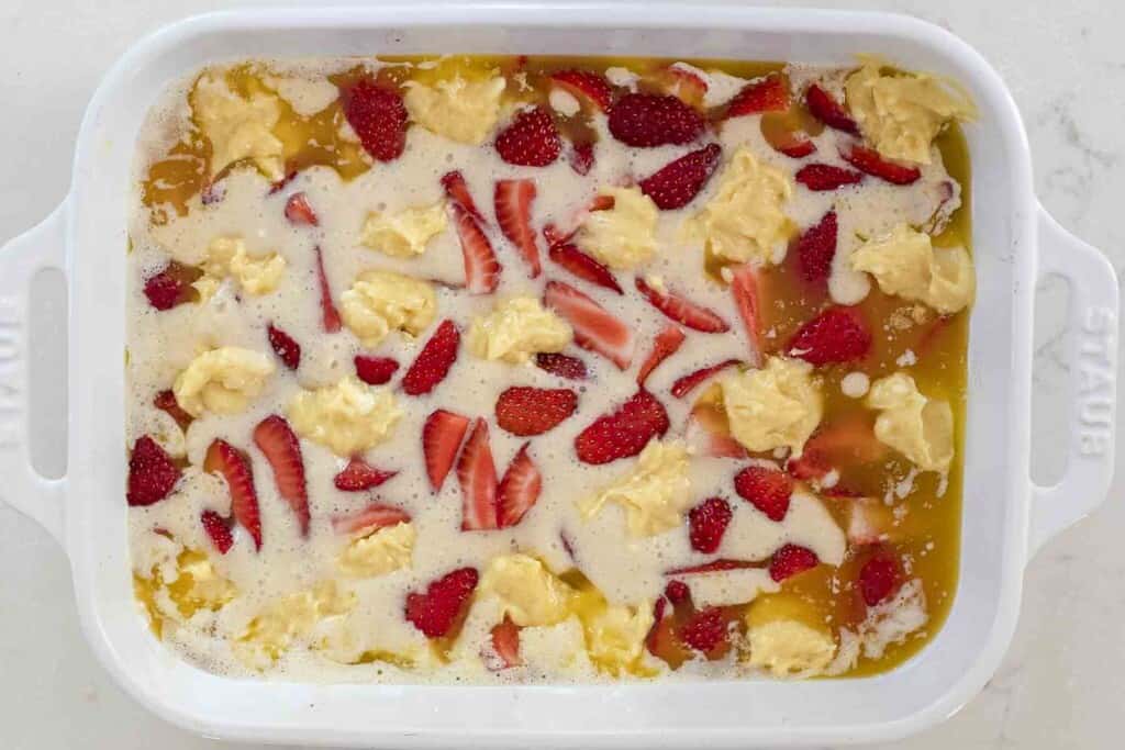 cream cheese mixture dolloped onto quarter strawberries, sourdough mixer and butter