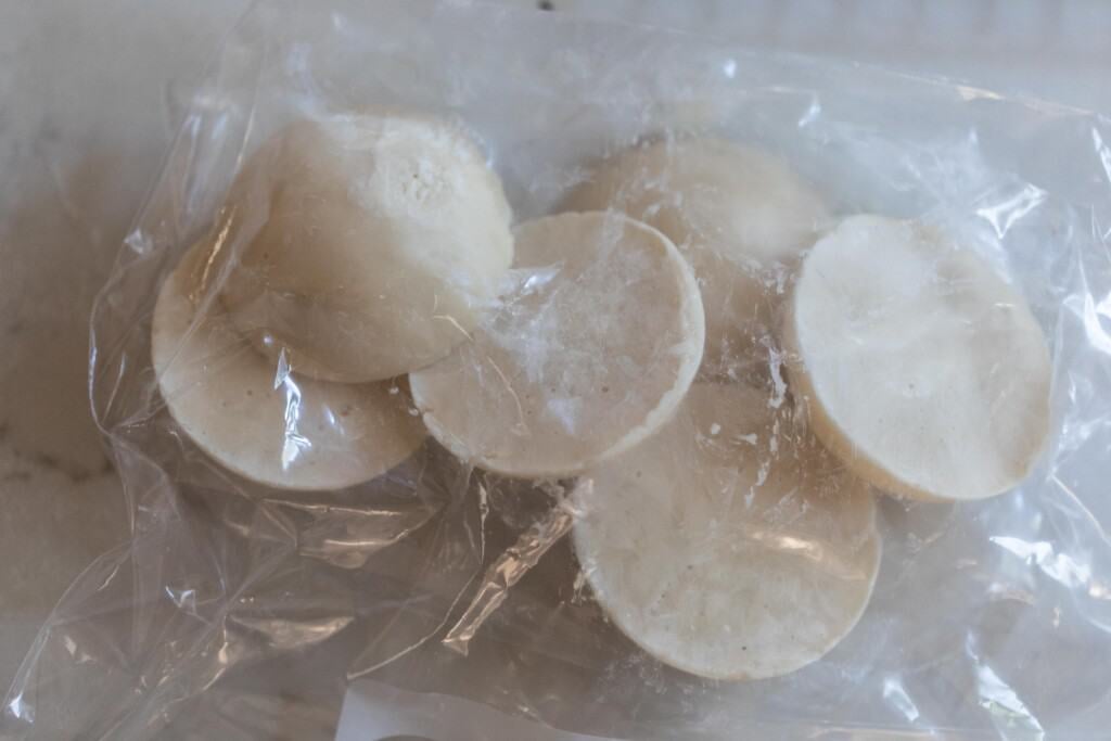 frozen sourdough disks in a plastic bag