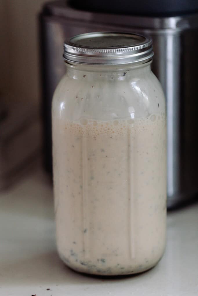 java chip ice cream base shaken up in a half gallon mason jar on a white countertop